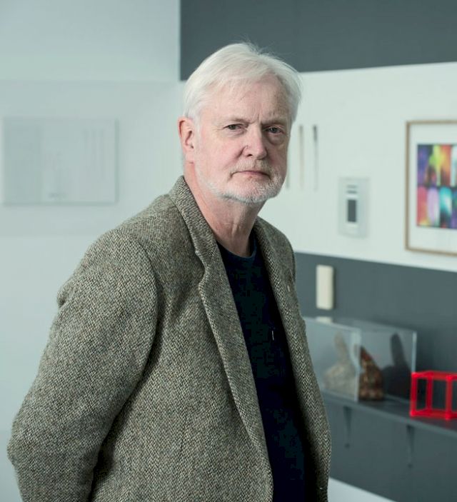 Portrait of Pétur Arason in his Reykjavik exhibition space, 2015. In the background: ", Cubit I - Selected Small Works from the collection of Pétur Arason and Ragna Róbertsdóttir". Curated by Birta Gudjonsdottir. Photo: Sigfús Már Pétursson