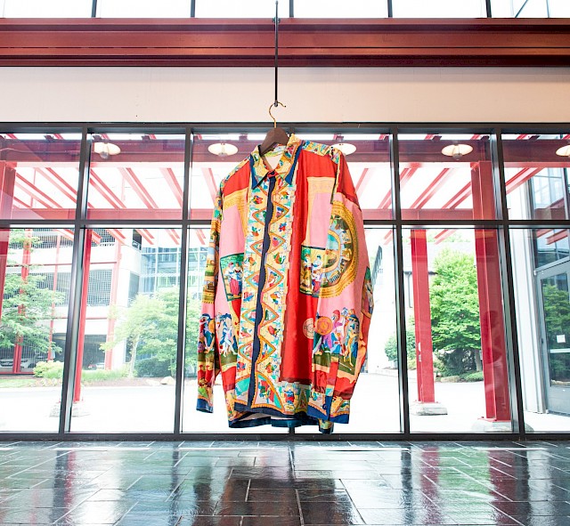 Andy Dixon, Versace Shirt, 2019, acrylic and oil stick on sewn canvas, ceramic buttons, wood and metal. Courtesy The West Collection at SEI, Oaks, PA