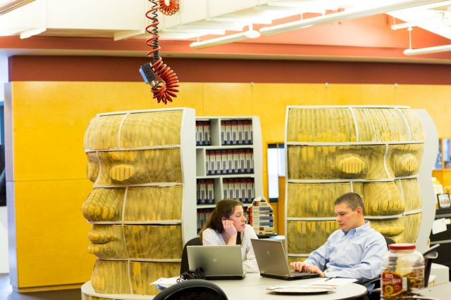 Long Bin Chen, Meeting Room, 2003, 1,000 carved New York City telephone books, wood shelving. Courtesy The West Collection at SEI, Oaks, PA