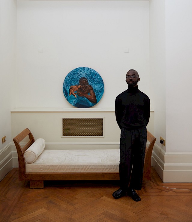 Joseph captured at home in London. Got You by Richard Mensah in the background, Courtesy of The Terra Collection of African Contemporary Art