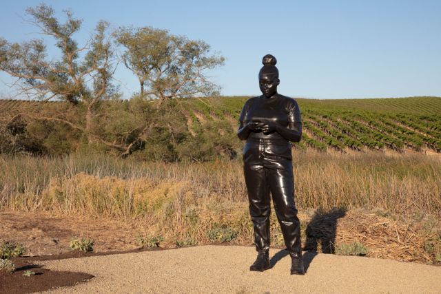 Thomas J Price, Reaching Out, 2021. Silicone bronze, 290 x 90 x 86 cm © The Donum Collection and the artist. Photo: Robert Berg