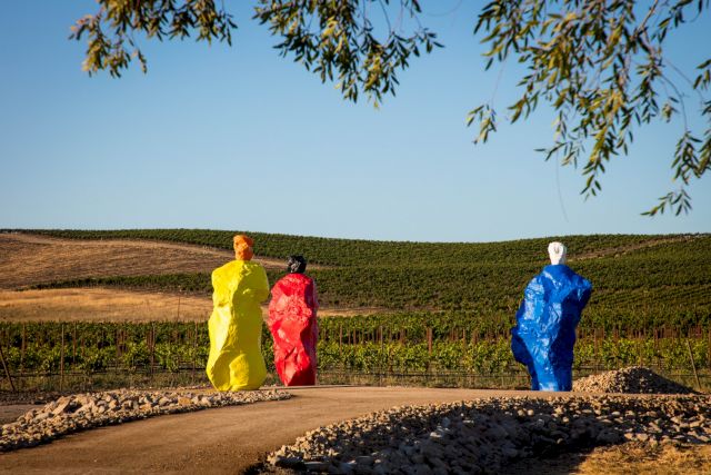 Ugo Rondinone, Nuns + monks (Orange Yellow Monk, Black Red Nun, and White Blue Monk). Painted bronze, various sizes, 2020 © The Donum Collection and the artist. Photo: Robert Berg