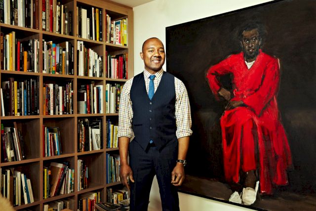Dr. Kenneth Montague at his home library with Lynette Yiadom-Boakye’s, ’Any Number of Preoccupations’, 2010